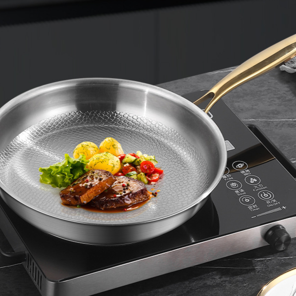 Titanium frying pan with hammer pattern finish