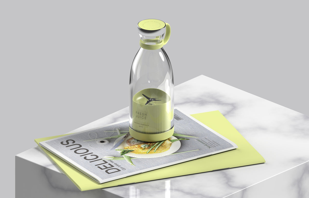 Green transparent blender on marble