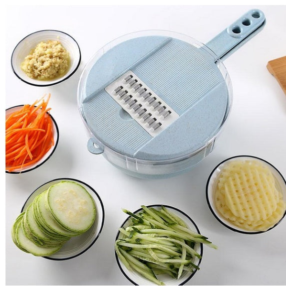 Blue slicer with julienned carrots, cucumber & grated potato