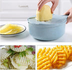 Potato being sliced into waffle-cut and thin chips