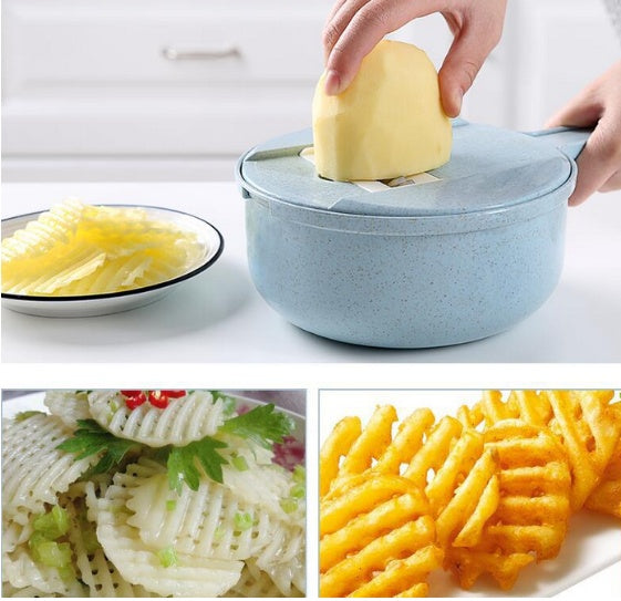 Potato being sliced into waffle-cut and thin chips