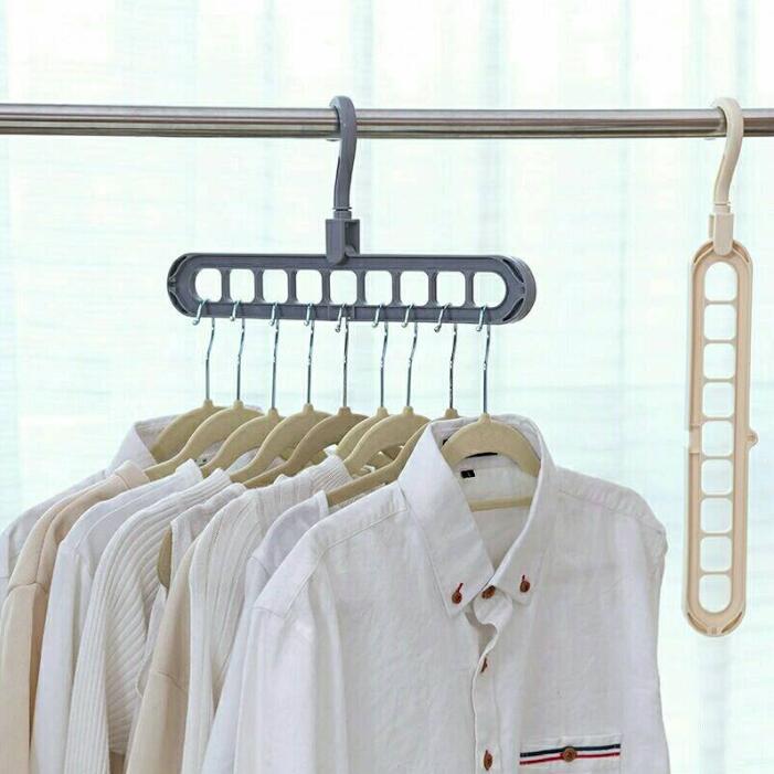 Grey and beige 360 rotating hanger hooks holding white shirts on a clothing rail
